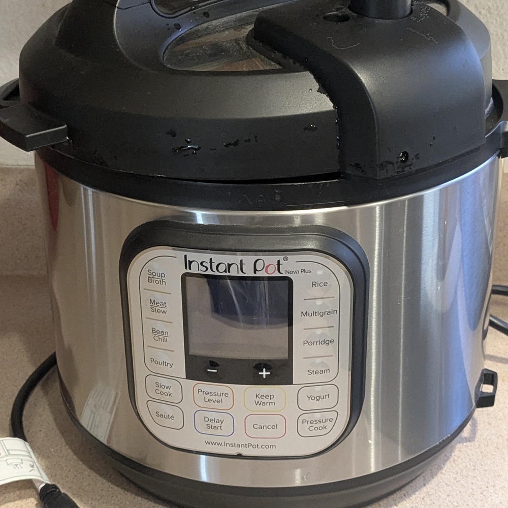 Instant Pot Duo Plus Black and Silver Pressure Cooker 6 Quarts